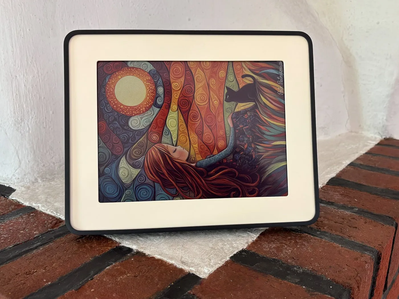 The black 10-inch Reflection Frame showing an illustration by Piotr Pietruszewski