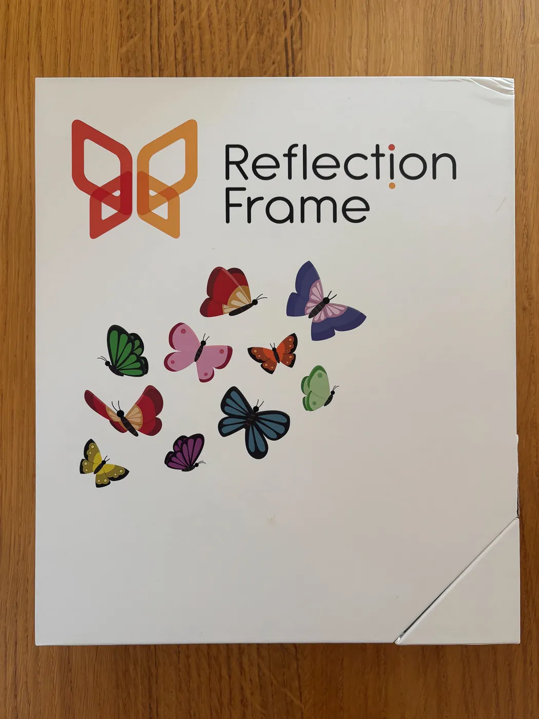 The box of the 10-inch Reflection Frame with its butterfly design