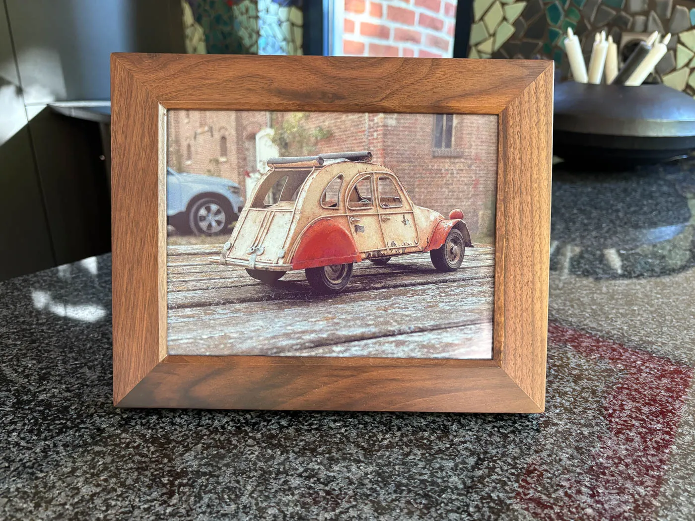 The walnut 10-inch Reflection Frame showing a photo of a model Citroën 2CV