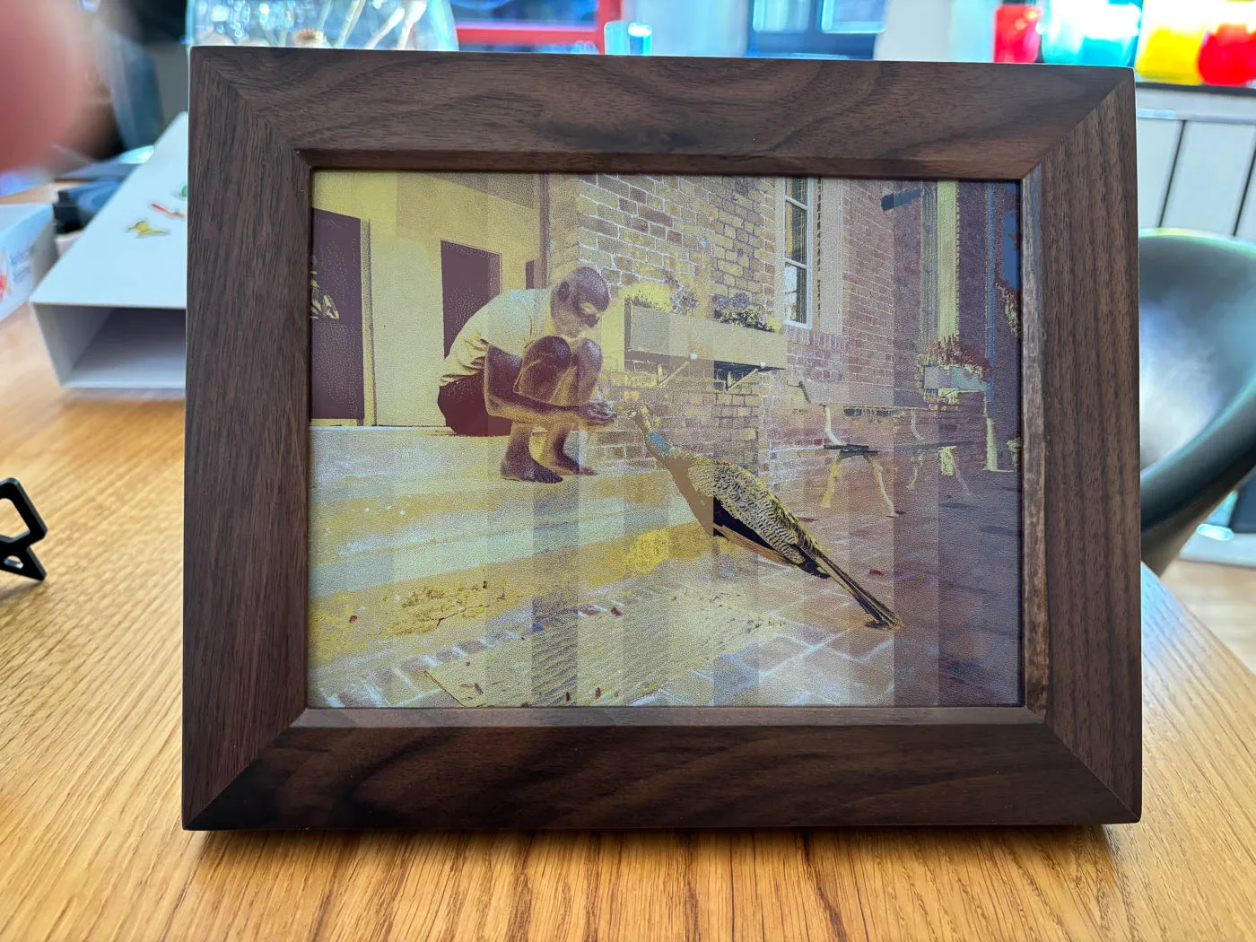 The walnut Reflection Frame shortly before the picture change is complete