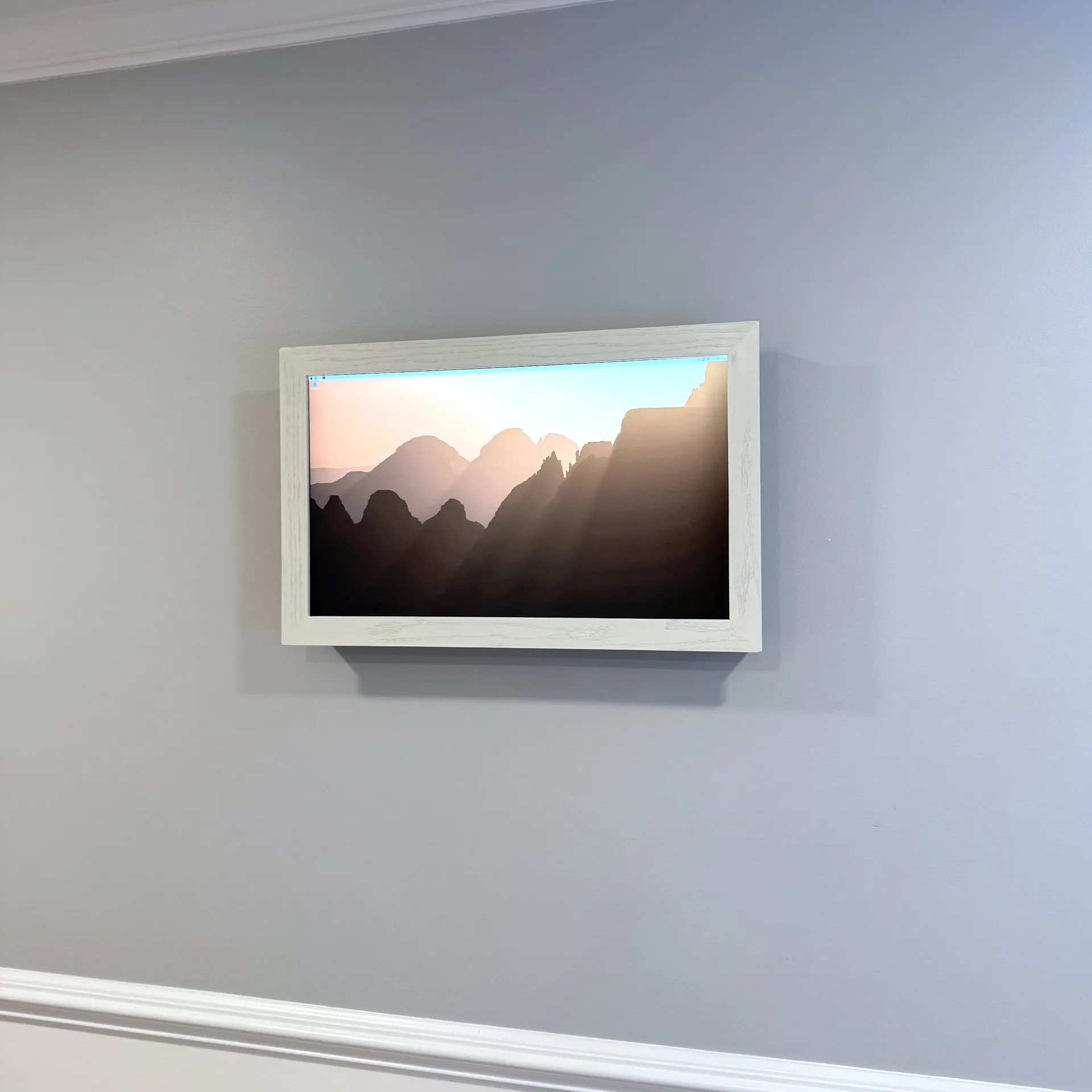 The same monitor inside a wooden surround